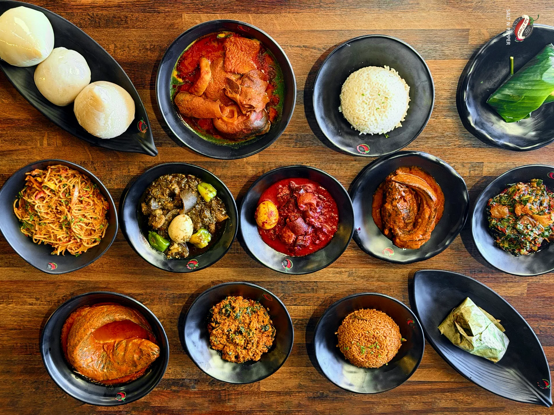 A spread of swallows, jollof, spaghetti, stews and soups